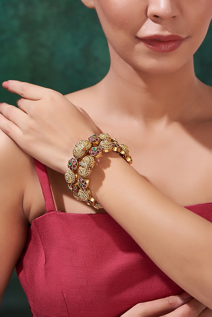 Gold Finish Multi-Colored Stone Bangles (Set Of 2) by 20AM at Pernia's Pop Up Shop