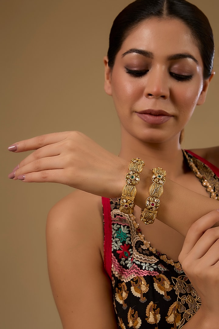 Gold Finish Kundan Polki & Ruby Gemstone Temple Bangles (Set Of 2) by 20AM at Pernia's Pop Up Shop