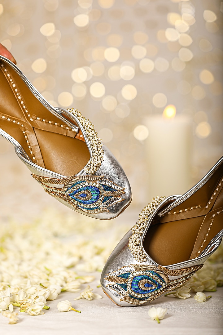 Silver Leatherette Peacock Embroidered Juttis by 5 Elements at Pernia's Pop Up Shop