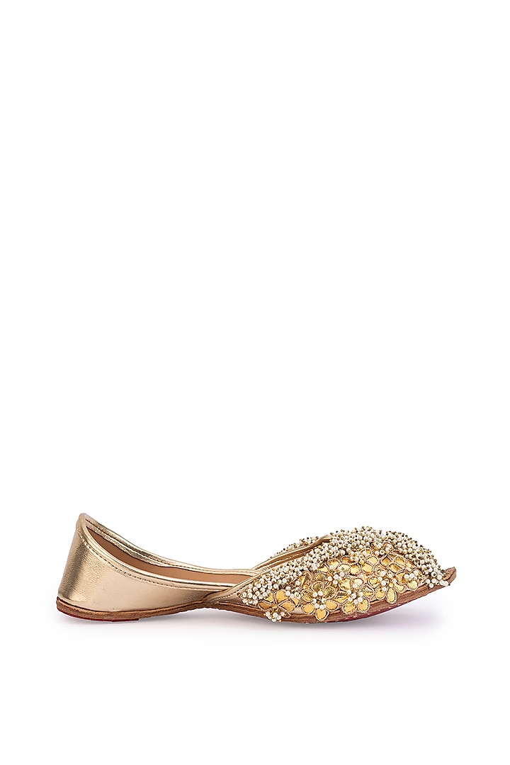Gold Leatherette Floral Motif Embroidered Juttis by 5 Elements at Pernia's Pop Up Shop