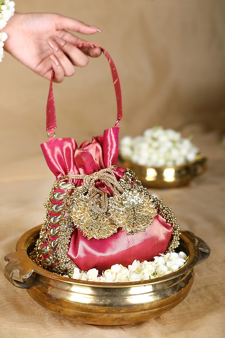 Pink Brocade Ghungroo Embroidered Potli Bag by 5 Elements at Pernia's Pop Up Shop