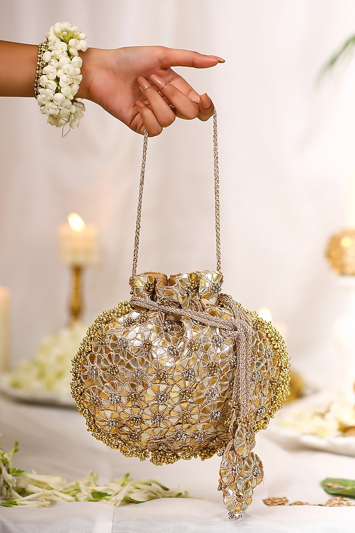 Gold PU Leather Gota Embroidered Potli Bag by 5 Elements at Pernia's Pop Up Shop