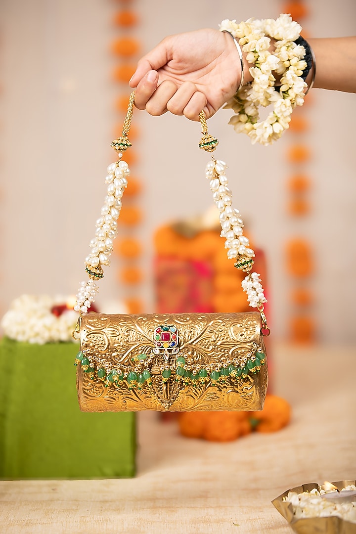 Gold Metallic Floral Embossed Handbag by 5 Elements at Pernia's Pop Up Shop