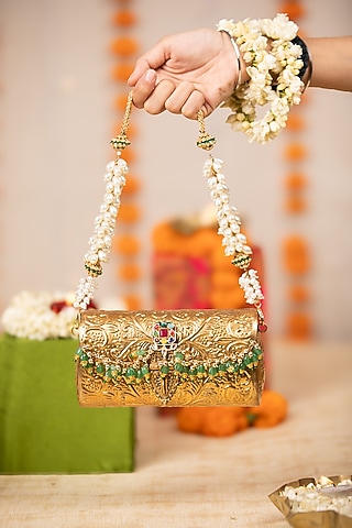 Gold Metallic Floral Embossed Handbag by 5 Elements