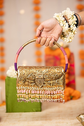 Gold Metallic Floral Embossed Handbag by 5 Elements
