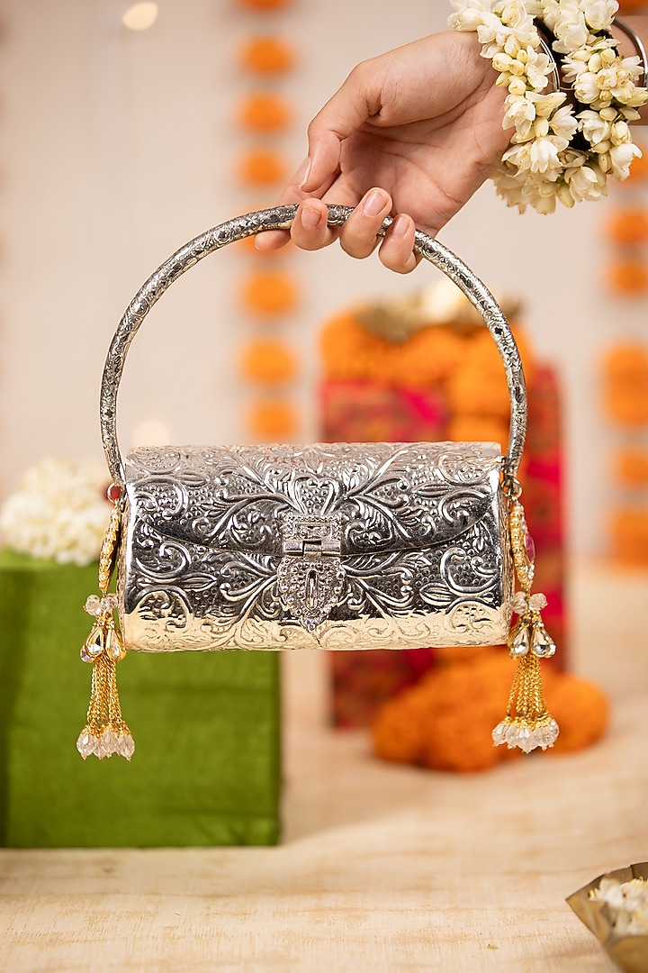 Silver Metallic Tassel Embellished Handbag by 5 Elements at Pernia's Pop Up Shop