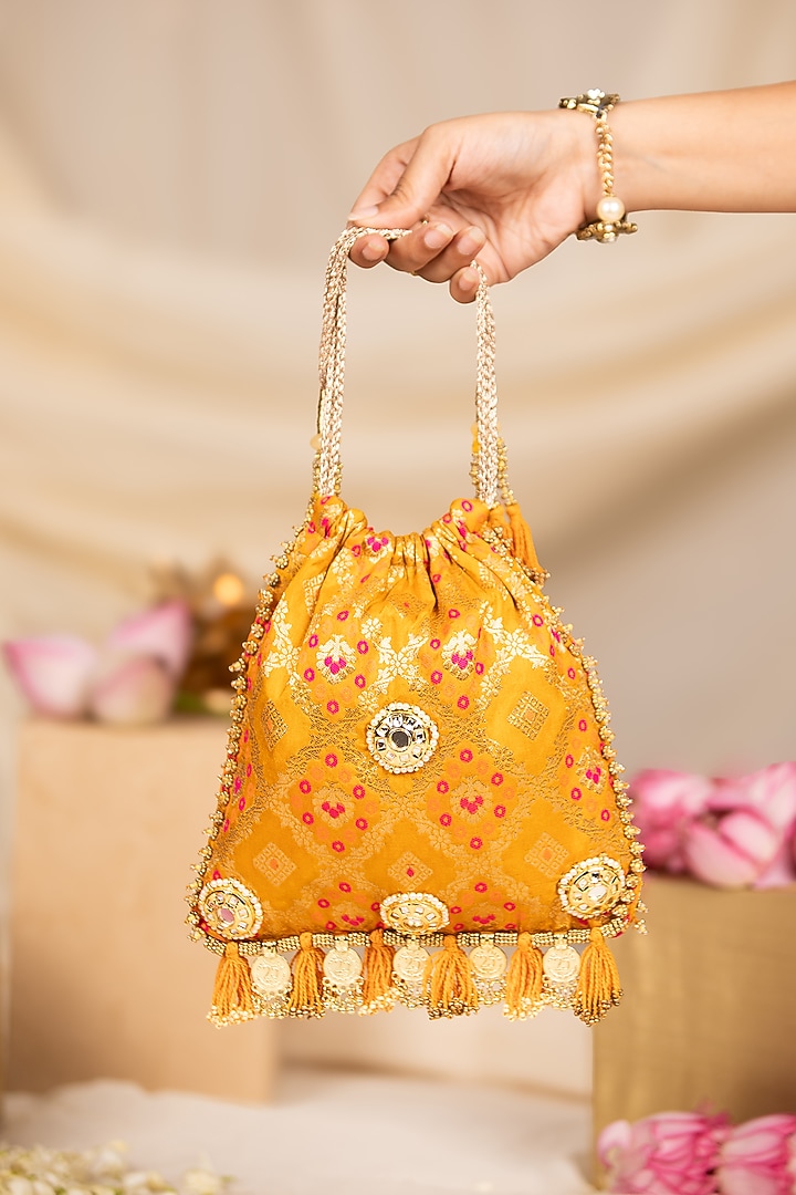 Yellow Silk Mirror Embellished Potli by 5 Elements at Pernia's Pop Up Shop