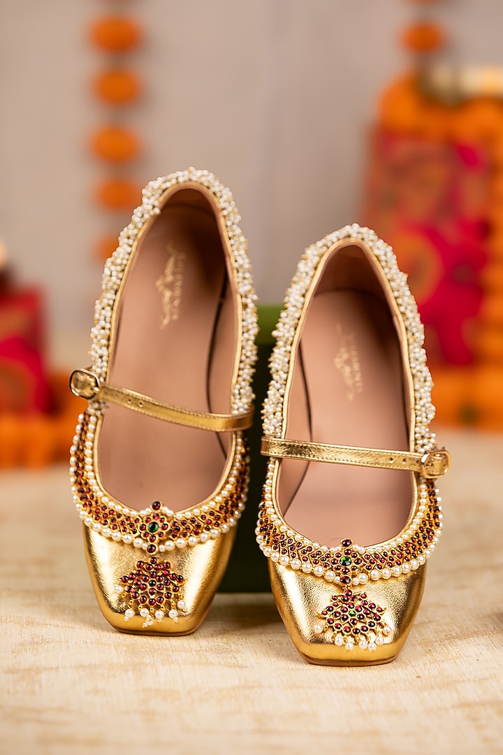 Gold Leatherette Pearl & Crystal Embellished Juttis by 5 Elements at Pernia's Pop Up Shop