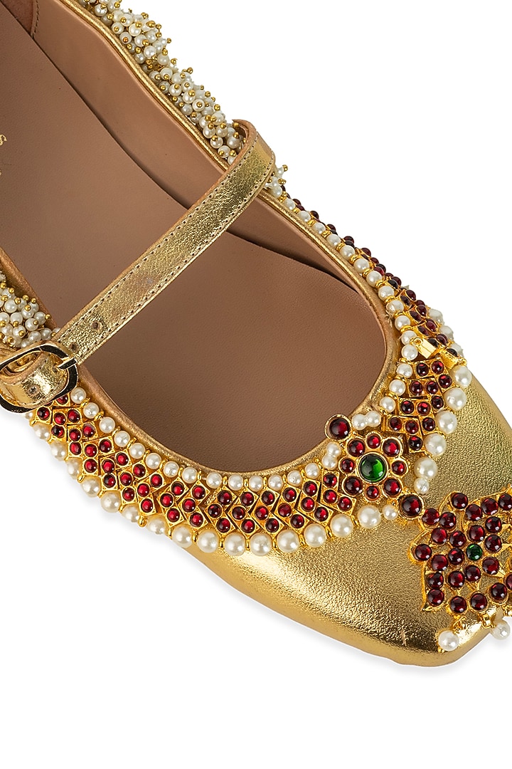 Gold Leatherette Pearl & Crystal Embellished Juttis by 5 Elements at Pernia's Pop Up Shop