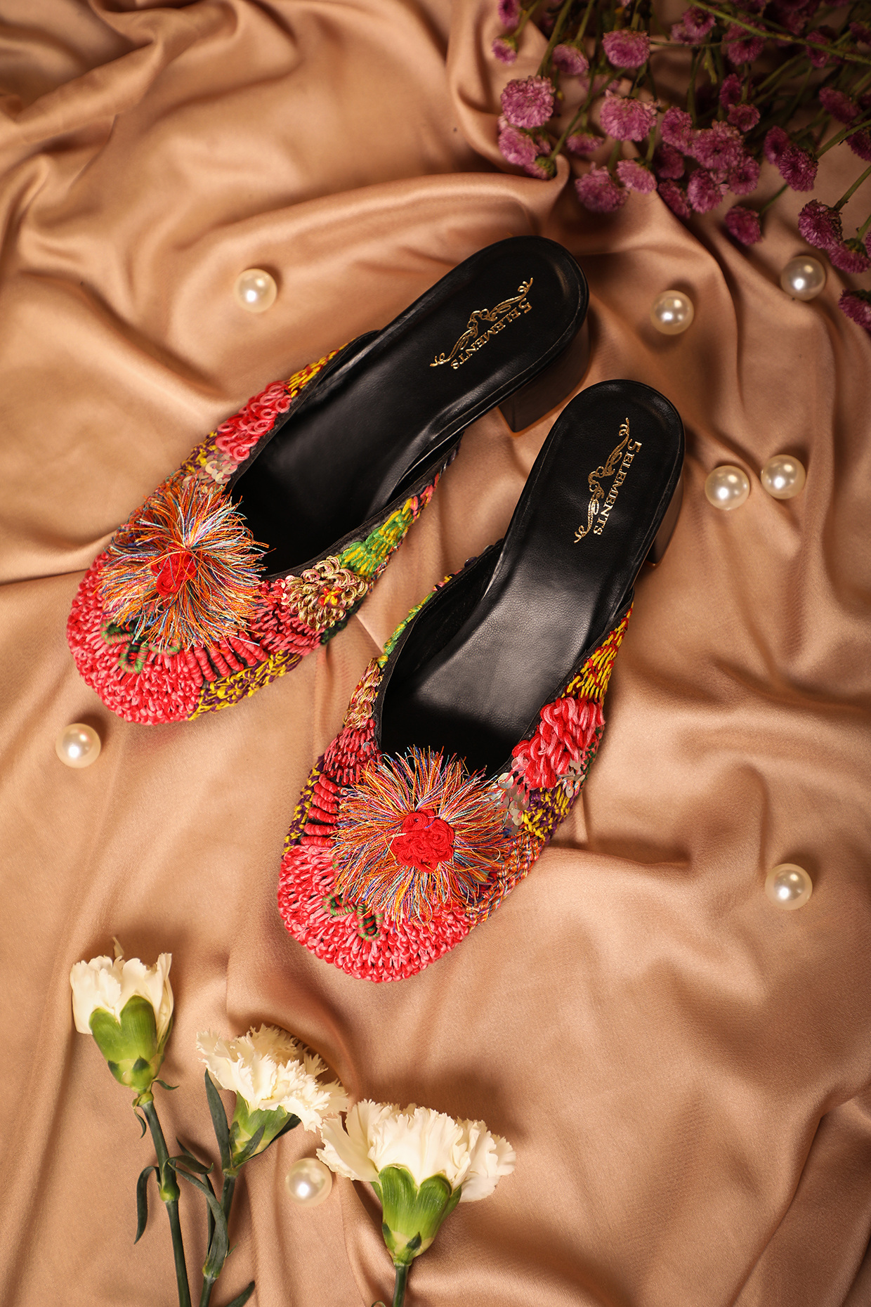 Black Leatherette Embroidered Mule Heels by 5 Elements at Pernia's Pop Up Shop
