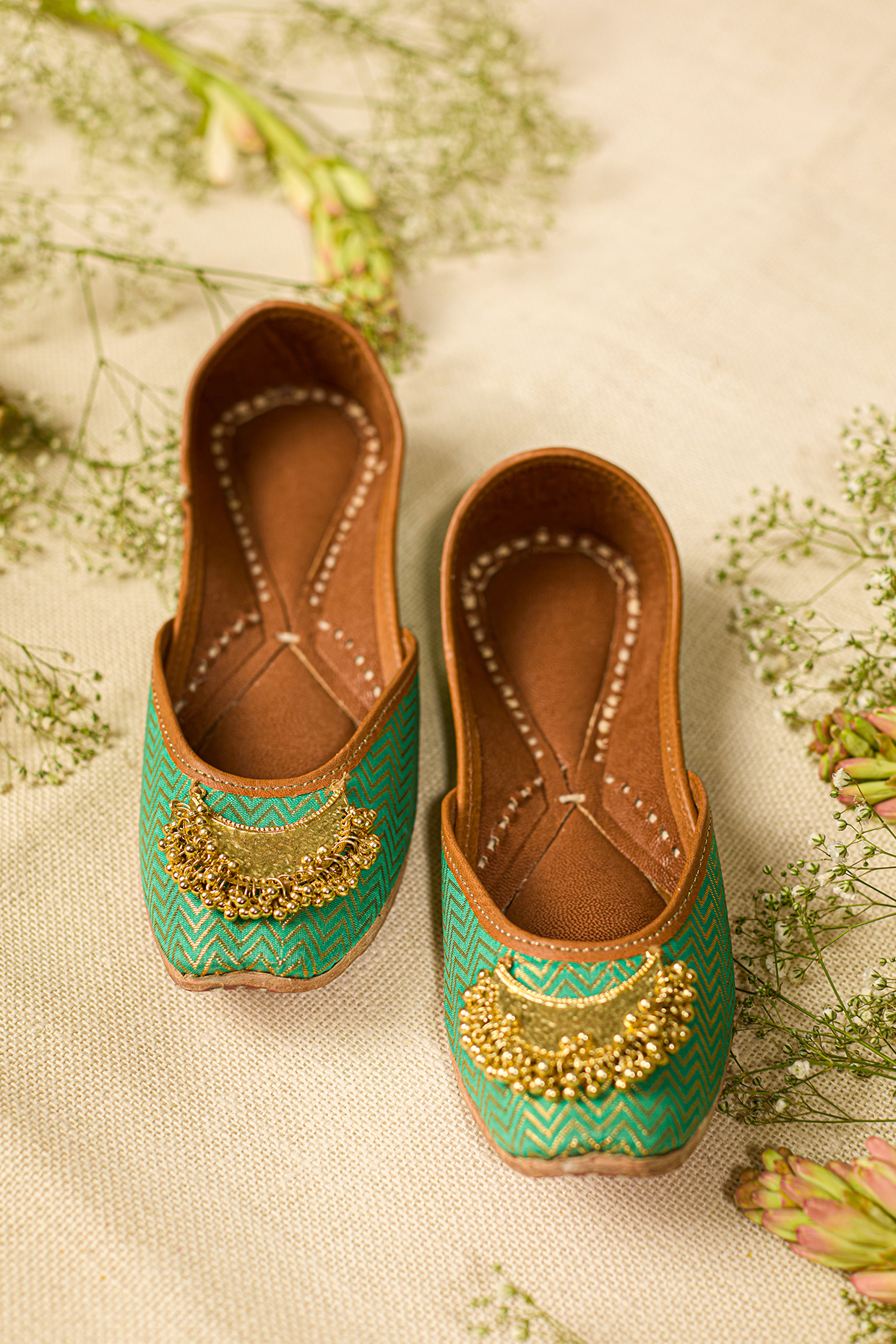 Green Leatherette Embellished Juttis by 5 Elements at Pernia's Pop Up Shop