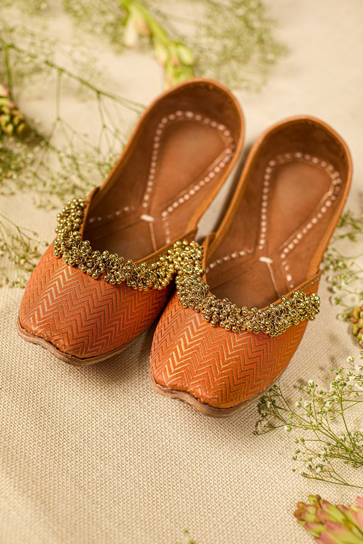 Orange Leatherette Embellished Juttis by 5 Elements at Pernia's Pop Up Shop