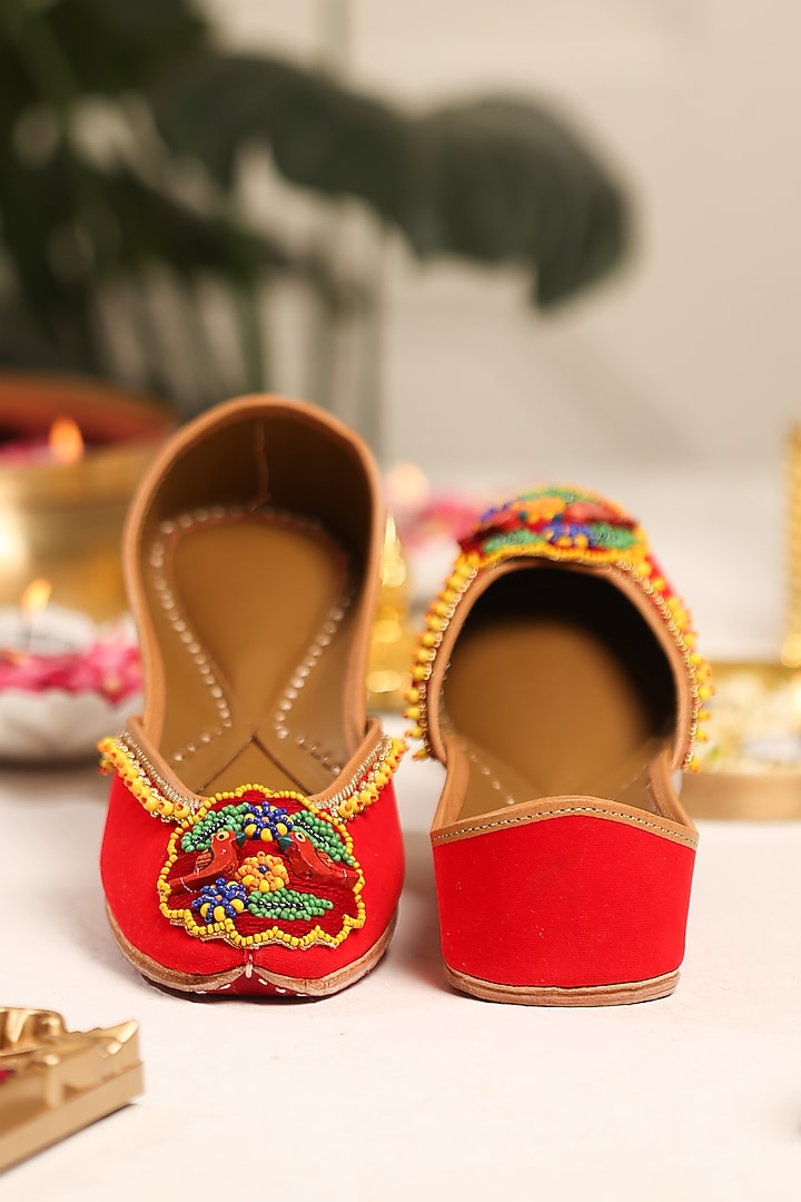 Red Leatherette Hand Embroidered Juttis by 5 Elements at Pernia's Pop Up Shop