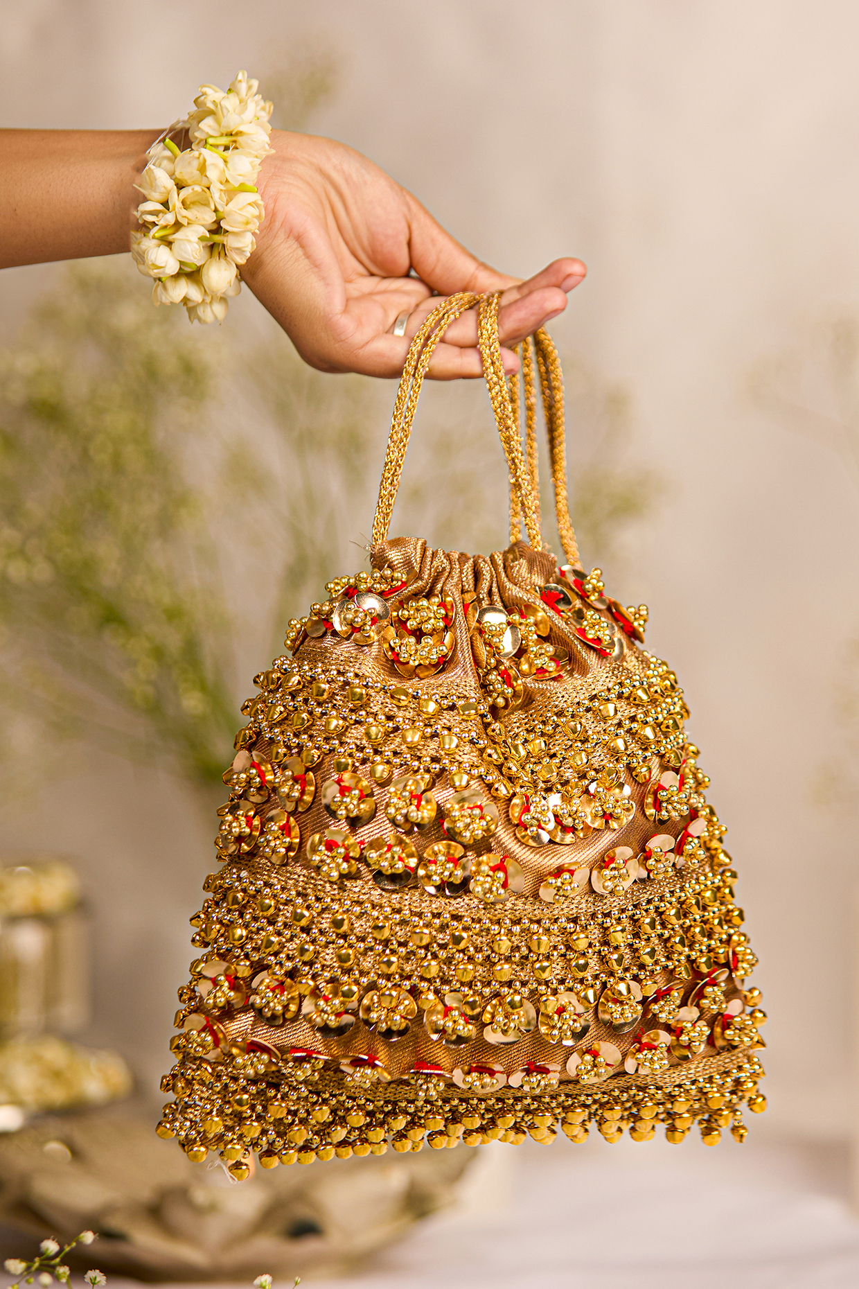 Golden Brocade Ghungroo Embellished Potli Bag by 5 Elements at Pernia's Pop Up Shop