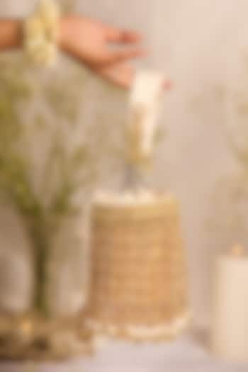 Golden Faux Leather Tassels Embellished Cylindrical Handbag by 5 Elements at Pernia's Pop Up Shop