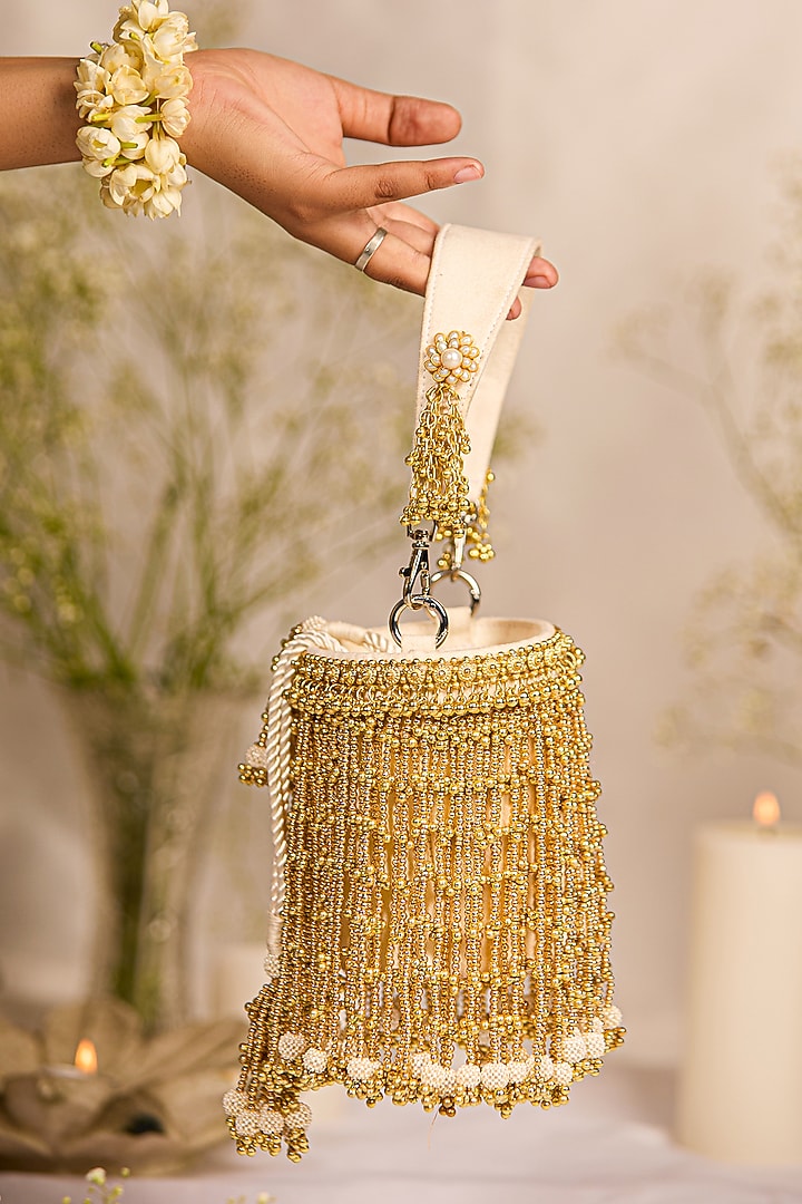 Golden Faux Leather Tassels Embellished Cylindrical Handbag by 5 Elements at Pernia's Pop Up Shop
