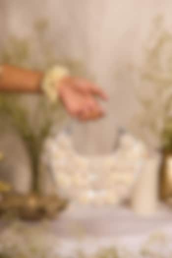 White Faux Leather Beaded Floral Moon-Shaped HandBag by 5 Elements at Pernia's Pop Up Shop