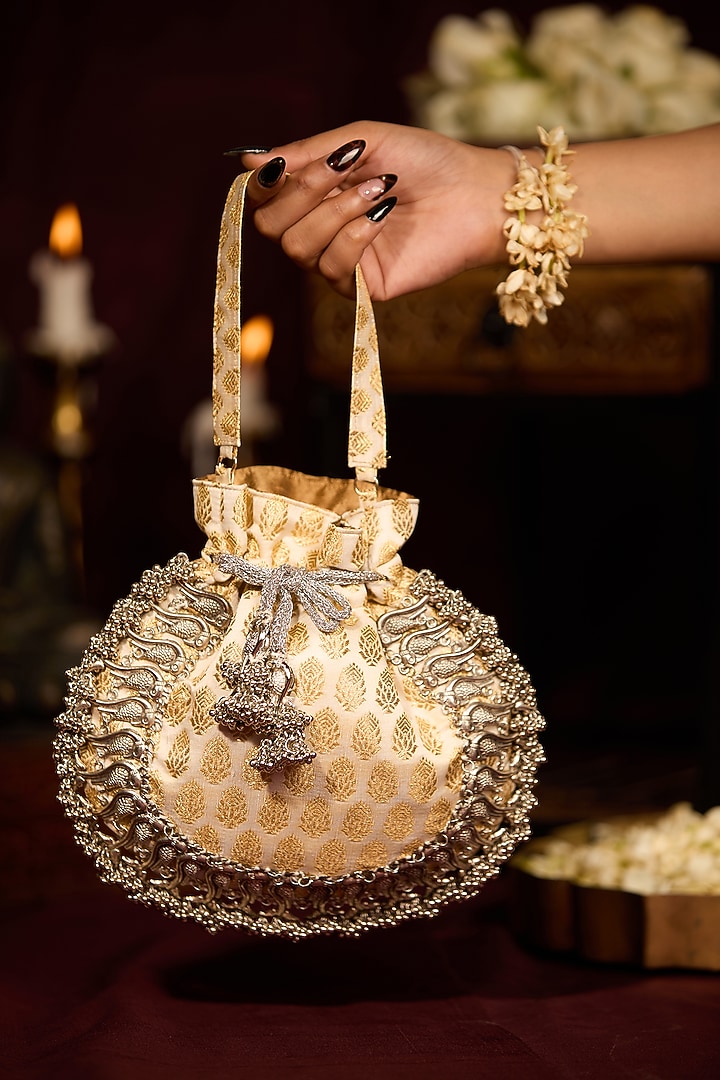 Off-White Cotton Floral Motif Embroidered Potli Bag by 5 Elements at Pernia's Pop Up Shop