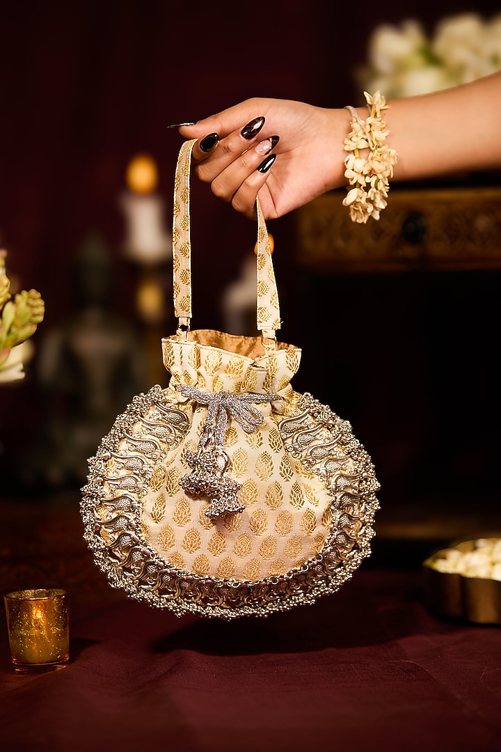 Off-White Cotton Floral Motif Embroidered Potli Bag by 5 Elements at Pernia's Pop Up Shop