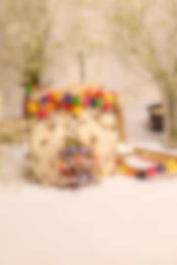 Off-White Jute Pom-Pom Embellished Potli Bag by 5 Elements at Pernia's Pop Up Shop