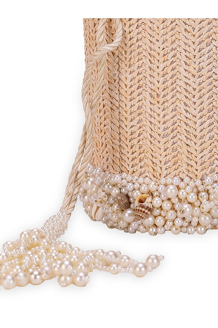 Off-White Jute Seashell Embellished Cylindrical Potli Bag by 5 Elements at Pernia's Pop Up Shop