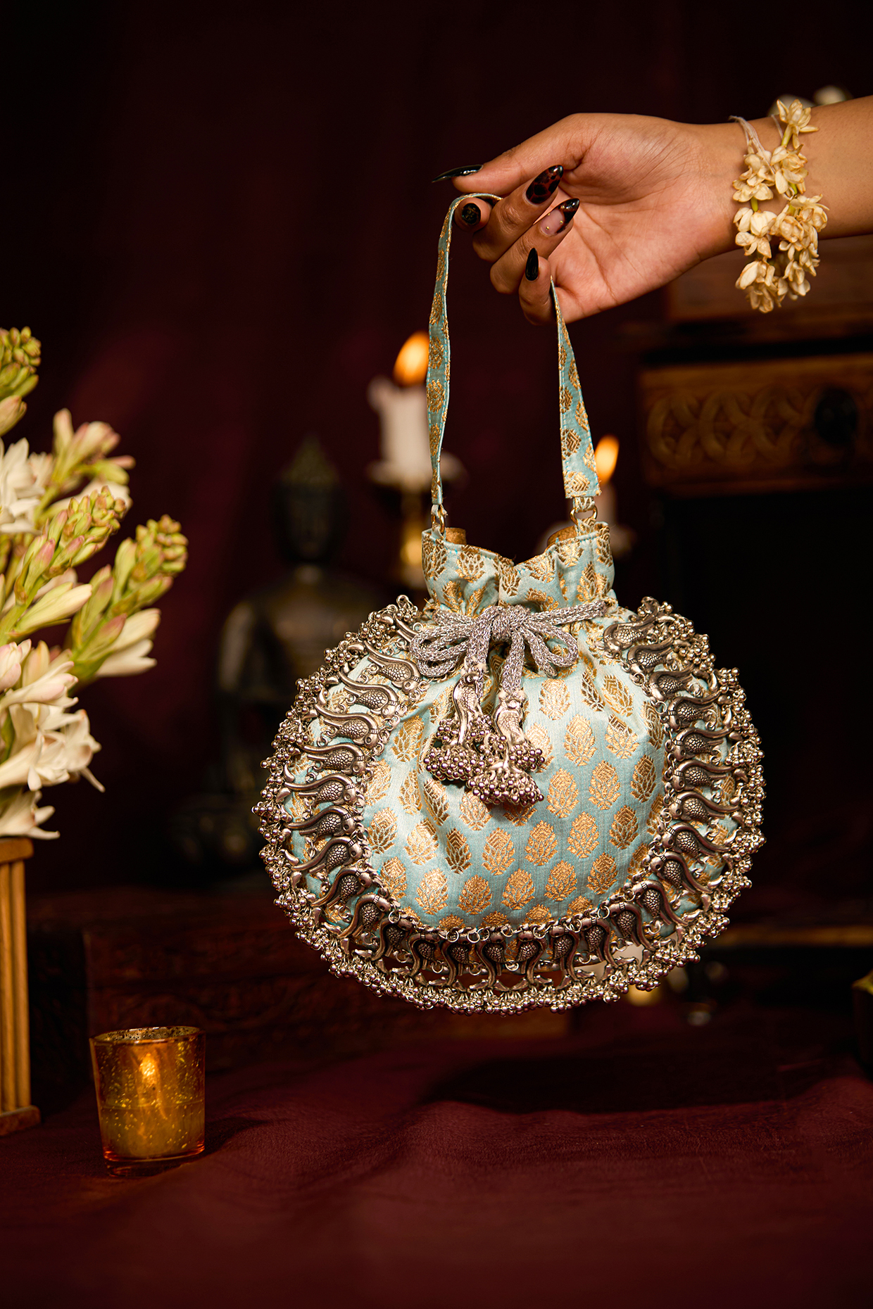Light Blue Brocade Embellished Textured Potli Bag by 5 Elements at Pernia's Pop Up Shop