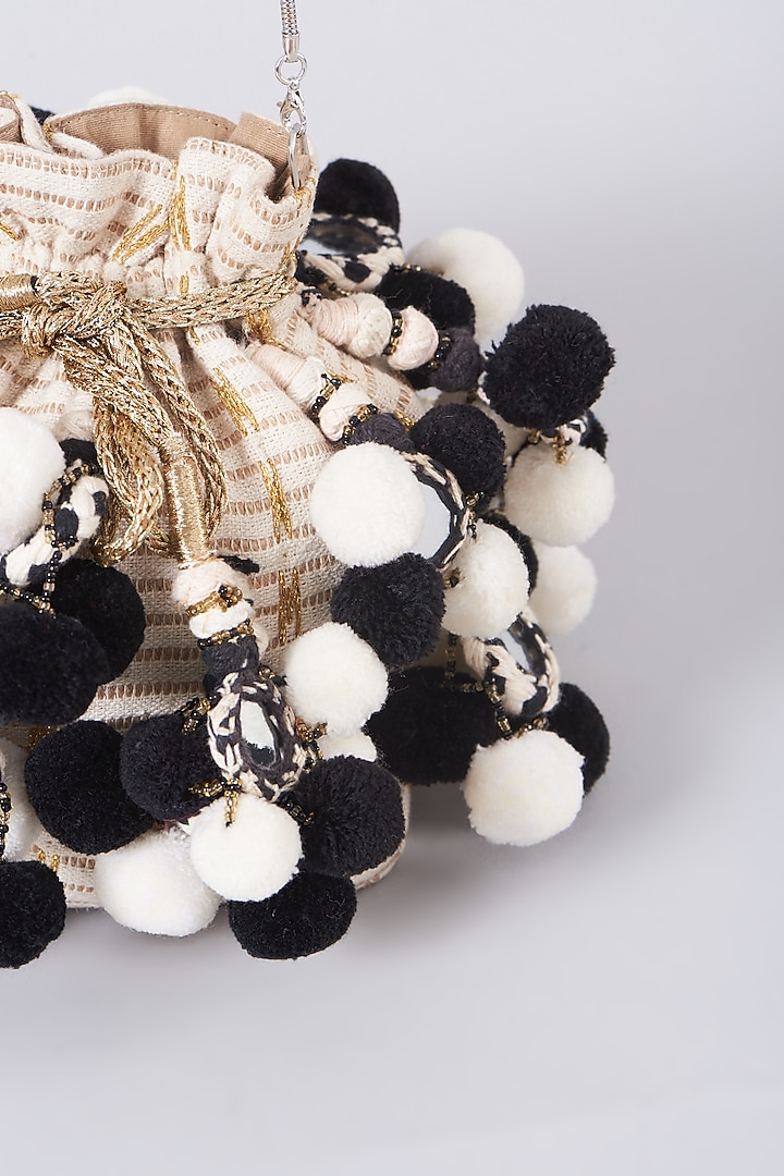 White & Black Potli With Pom Poms by 5 Elements at Pernia's Pop Up Shop