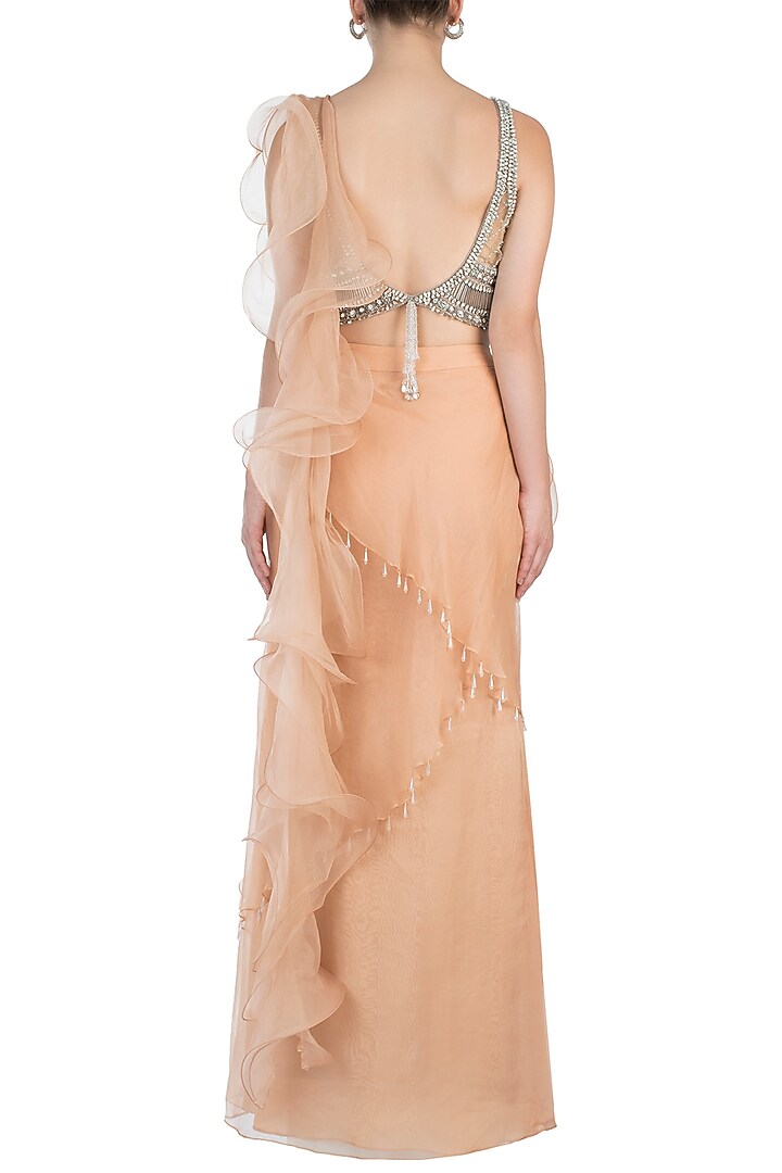 Nude embroidered ruffle skirt saree with blouse available only at Pernia's Pop Up Shop.