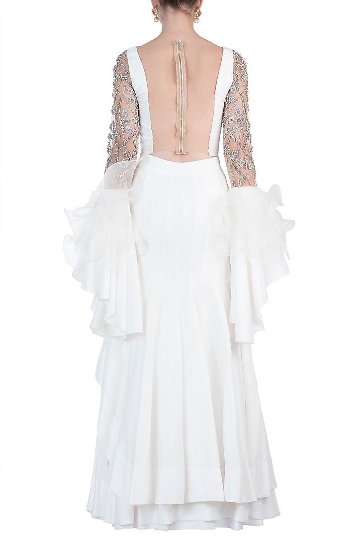 Ivory embroidered ruffle blouse with lehenga skirt available only at Pernia's Pop Up Shop.