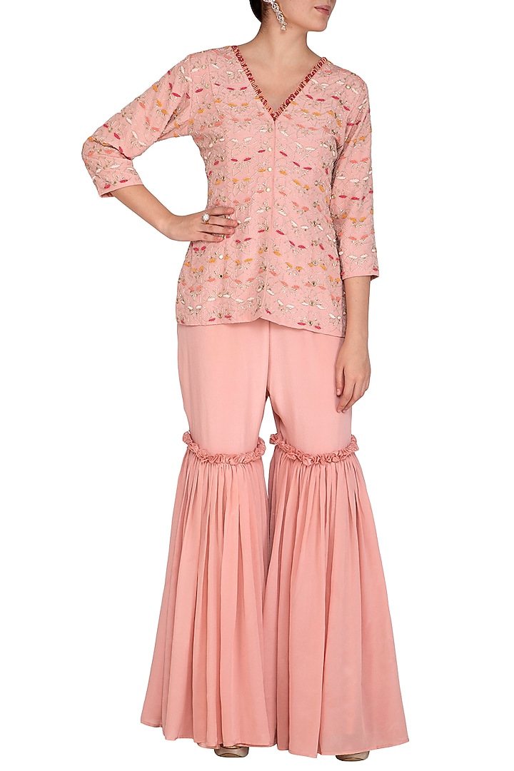 Dusty Rose Pink Embroidered Peplum Top With Gharara Pants by Aashna Behl at Pernia's Pop Up Shop