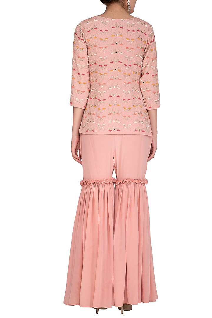 Dusty Rose Pink Embroidered Peplum Top With Gharara Pants by Aashna Behl at Pernia's Pop Up Shop