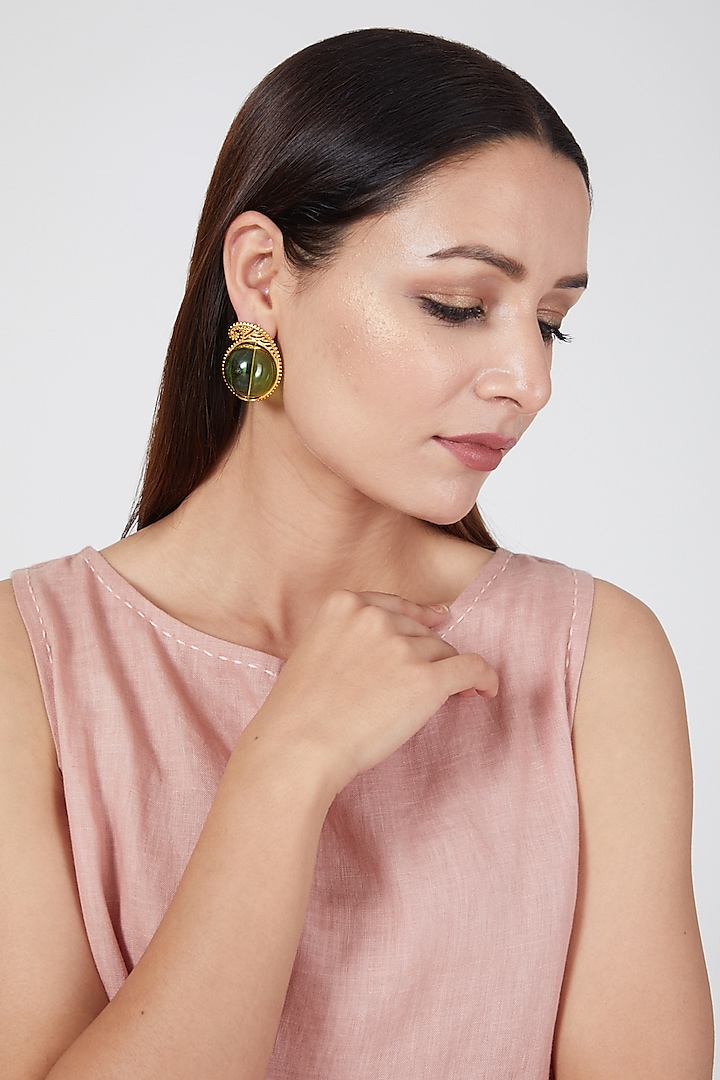 Gold Finish Earrings With Glass Orb by Aadikara