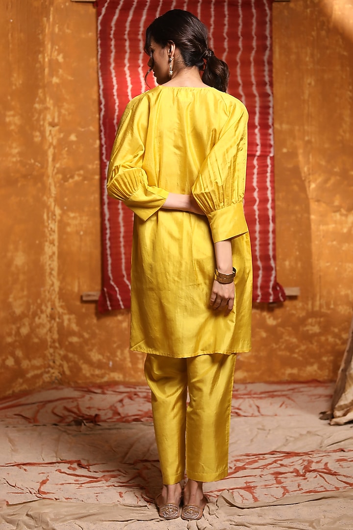 Mustard Pure Silk Tribal Motif Hand Embroidered Kurta Set by Shivani Bhargava at Pernia's Pop Up Shop