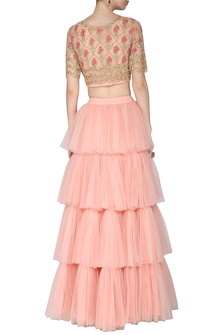Peach embroidered blouse with tiered ruffles lehenga skirt available only at Pernia's Pop Up Shop.