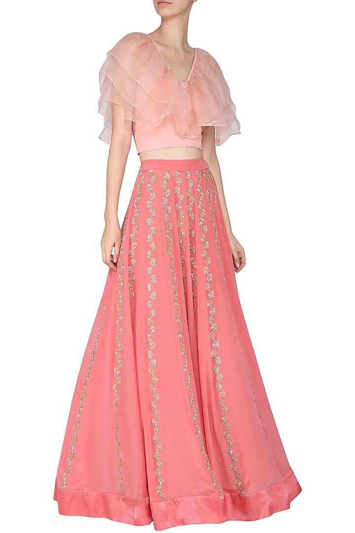 Peach ruffles blouse with pink embroidered lehenga skirt available only at Pernia's Pop Up Shop.