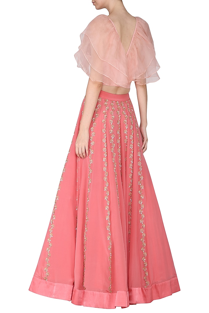 Peach ruffles blouse with pink embroidered lehenga skirt available only at Pernia's Pop Up Shop.