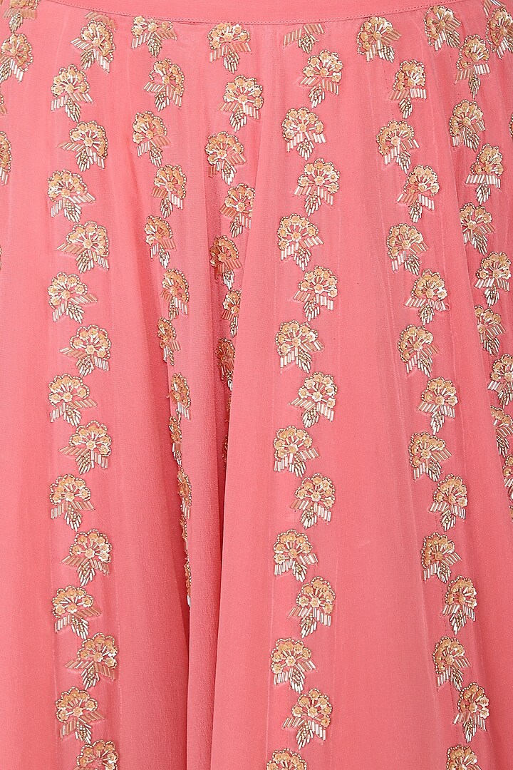 Peach ruffles blouse with pink embroidered lehenga skirt available only at Pernia's Pop Up Shop.