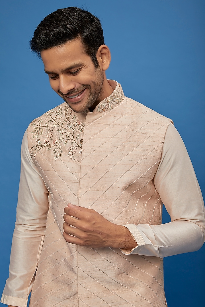 Powder Pink Raw Silk Embroidered Bundi Jacket Set by AUGUST by Swati Akash Jhunjhunwala at Pernia's Pop Up Shop