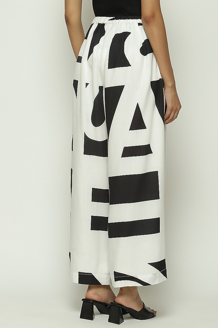 White Tencel Cotton Printed Palazzo Pants by Abraham & Thakore at Pernia's Pop Up Shop