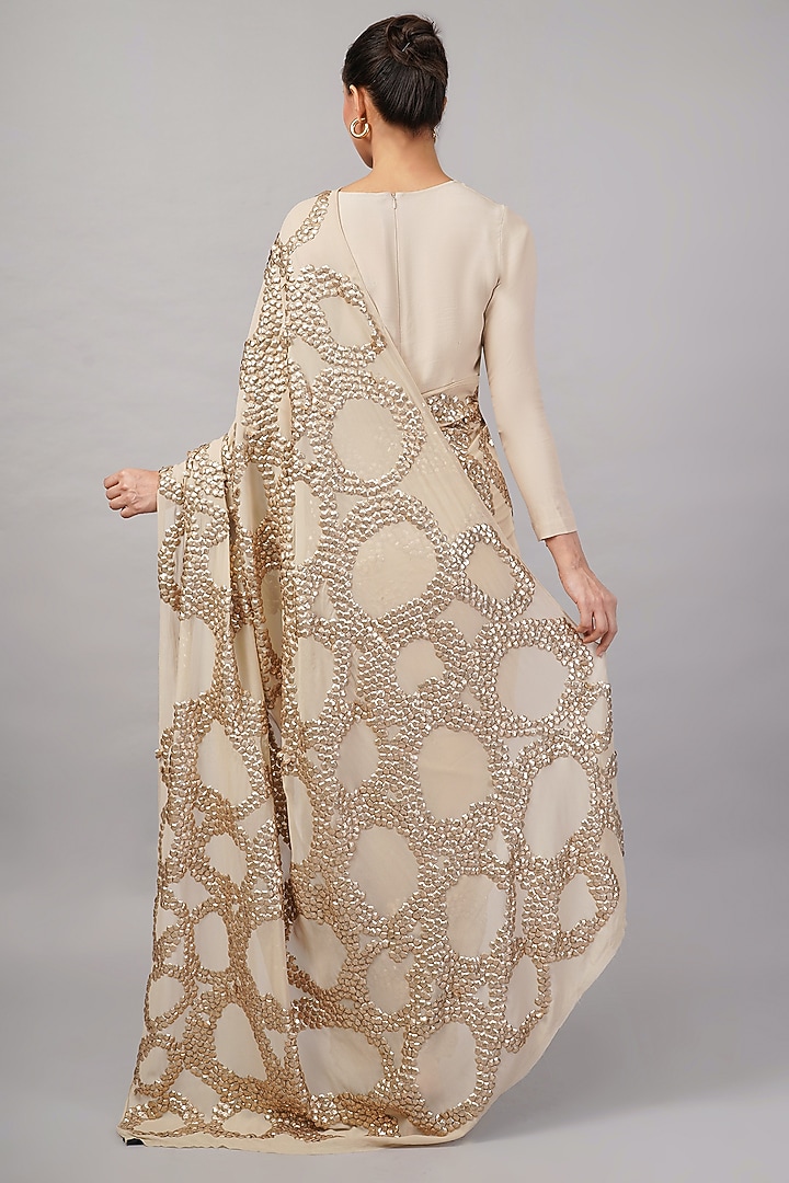 Beige Organza Metallic Sequins Hand Embroidered Wedding Saree by Abraham & Thakore at Pernia's Pop Up Shop