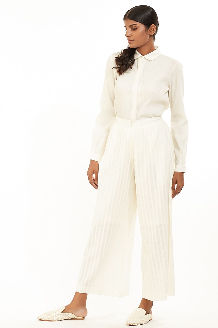 Ivory Pleated Cambric Pants by Abraham & Thakore at Pernia's Pop Up Shop