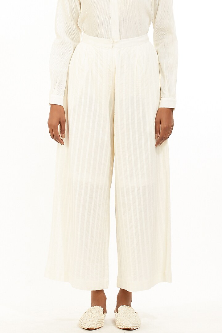 Ivory Pleated Cambric Pants by Abraham & Thakore at Pernia's Pop Up Shop