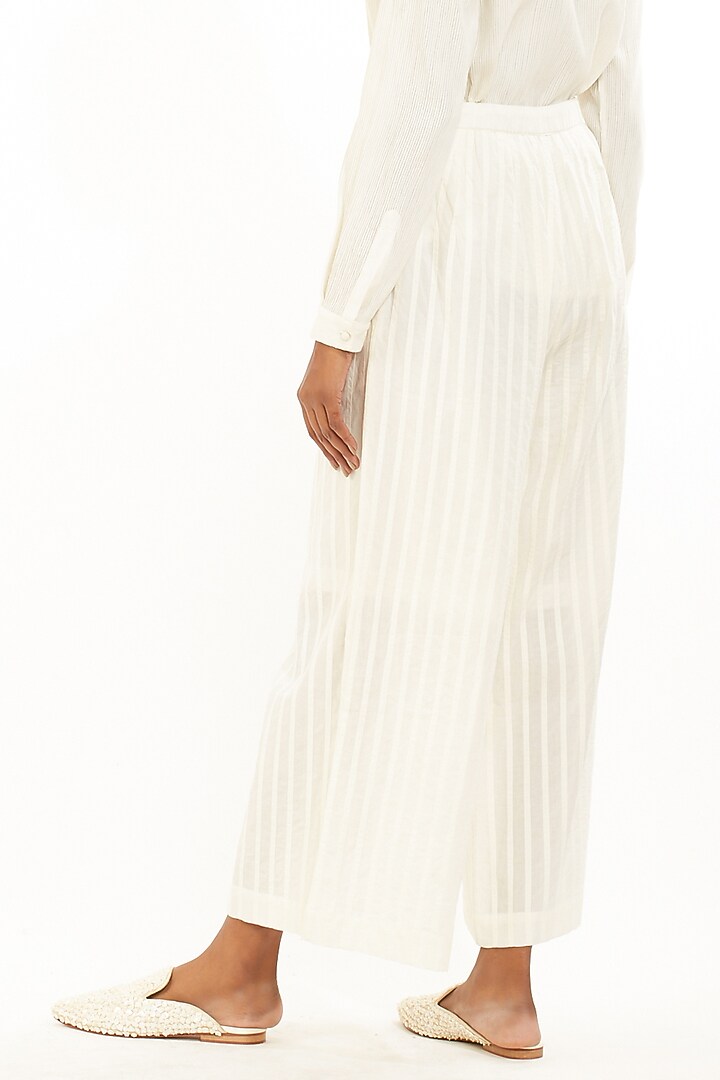 Ivory Pleated Cambric Pants by Abraham & Thakore at Pernia's Pop Up Shop