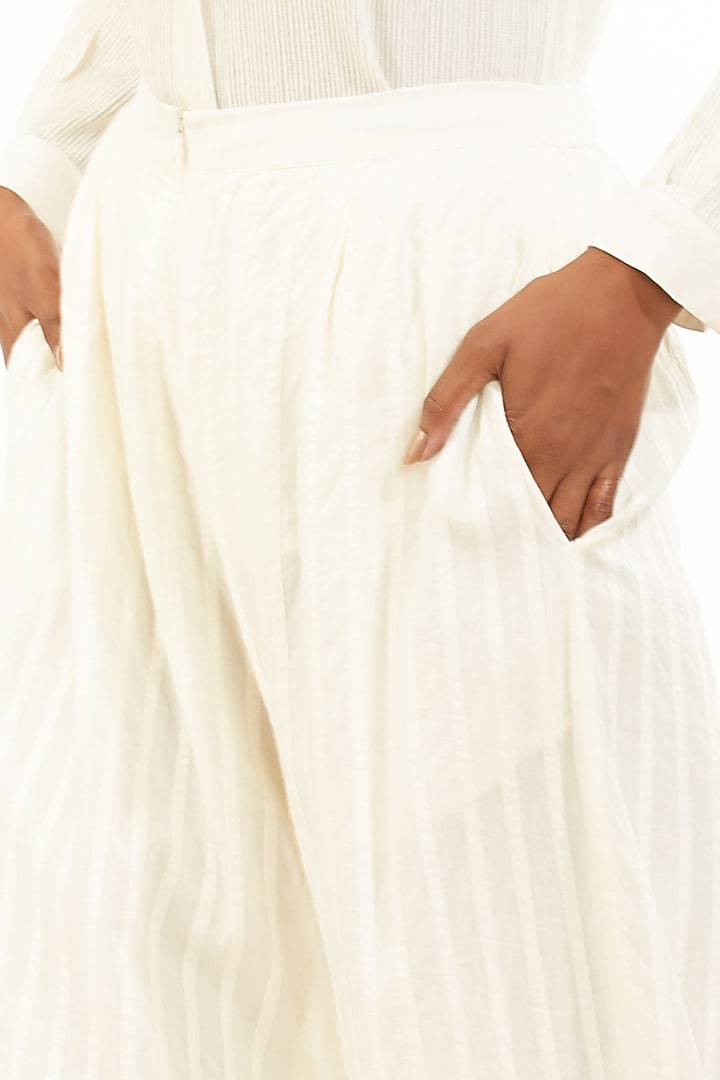 Ivory Pleated Cambric Pants by Abraham & Thakore at Pernia's Pop Up Shop