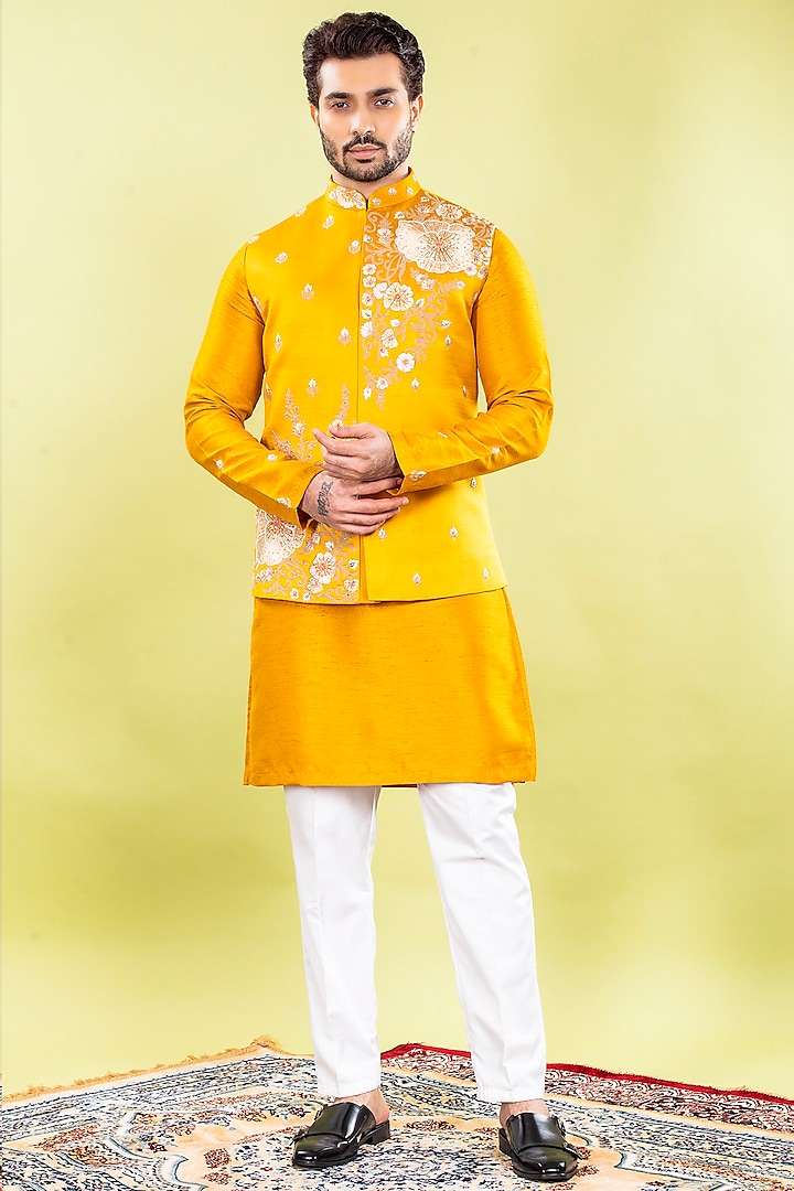 Mustard Yellow Raw Silk Machine & Hand Embroidered Bundi Jacket Set by ACHKANN at Pernia's Pop Up Shop