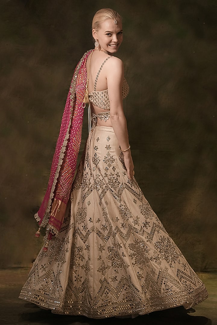 Ivory Raw Silk Bandhani Printed & Mirror Embroidered Bridal Lehenga Set by Archana Kochhar at Pernia's Pop Up Shop
