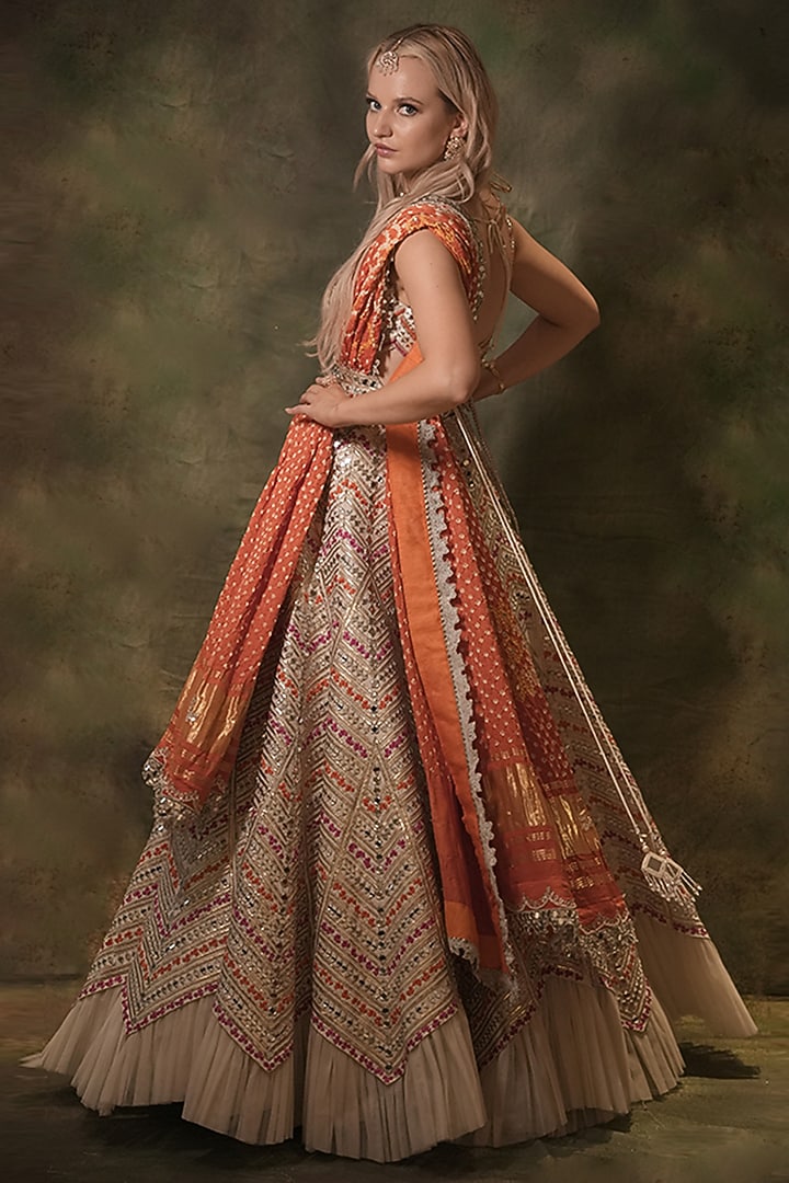 Ivory Raw Silk Bandhani Printed & Mirror Embroidered Wedding Lehenga Set by Archana Kochhar at Pernia's Pop Up Shop