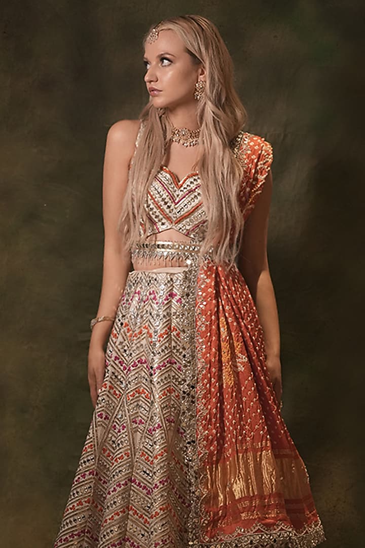 Ivory Raw Silk Bandhani Printed & Mirror Embroidered Wedding Lehenga Set by Archana Kochhar at Pernia's Pop Up Shop