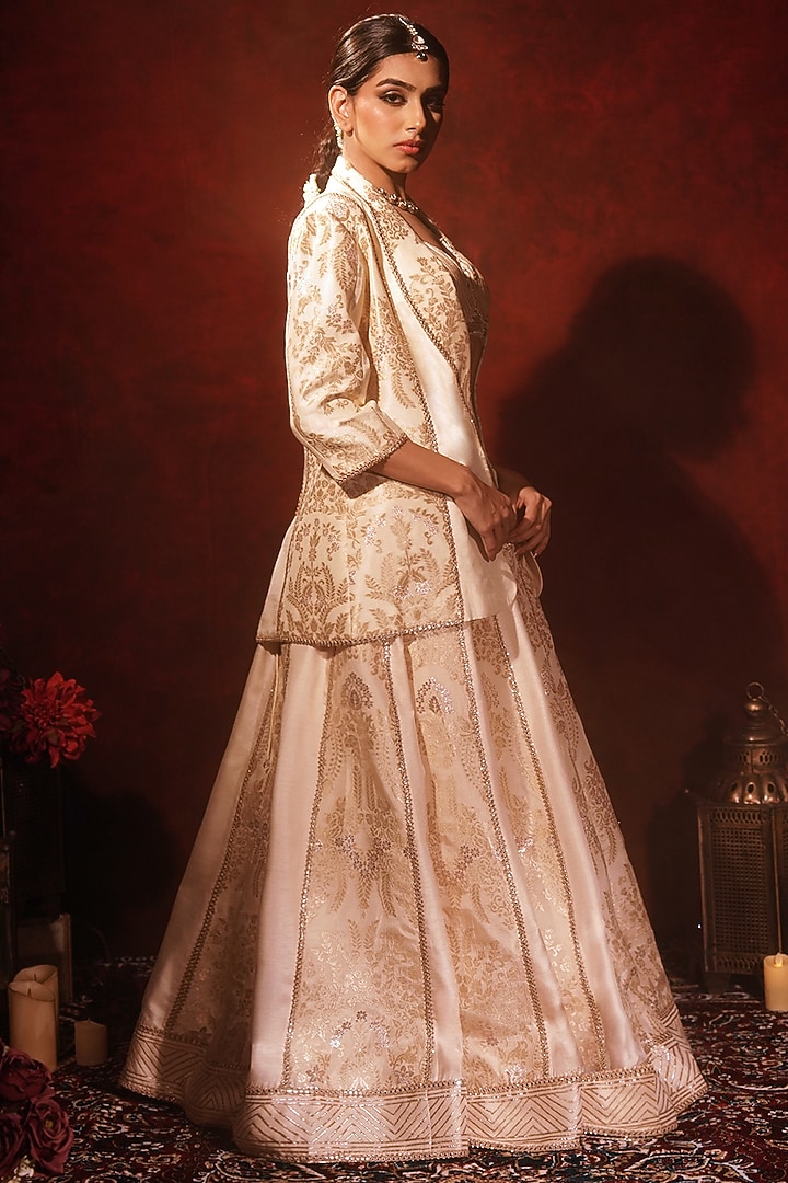 Ivory Brocade Silk & Raw Silk Embroidered Wedding Lehenga Set by Archana Kochhar at Pernia's Pop Up Shop