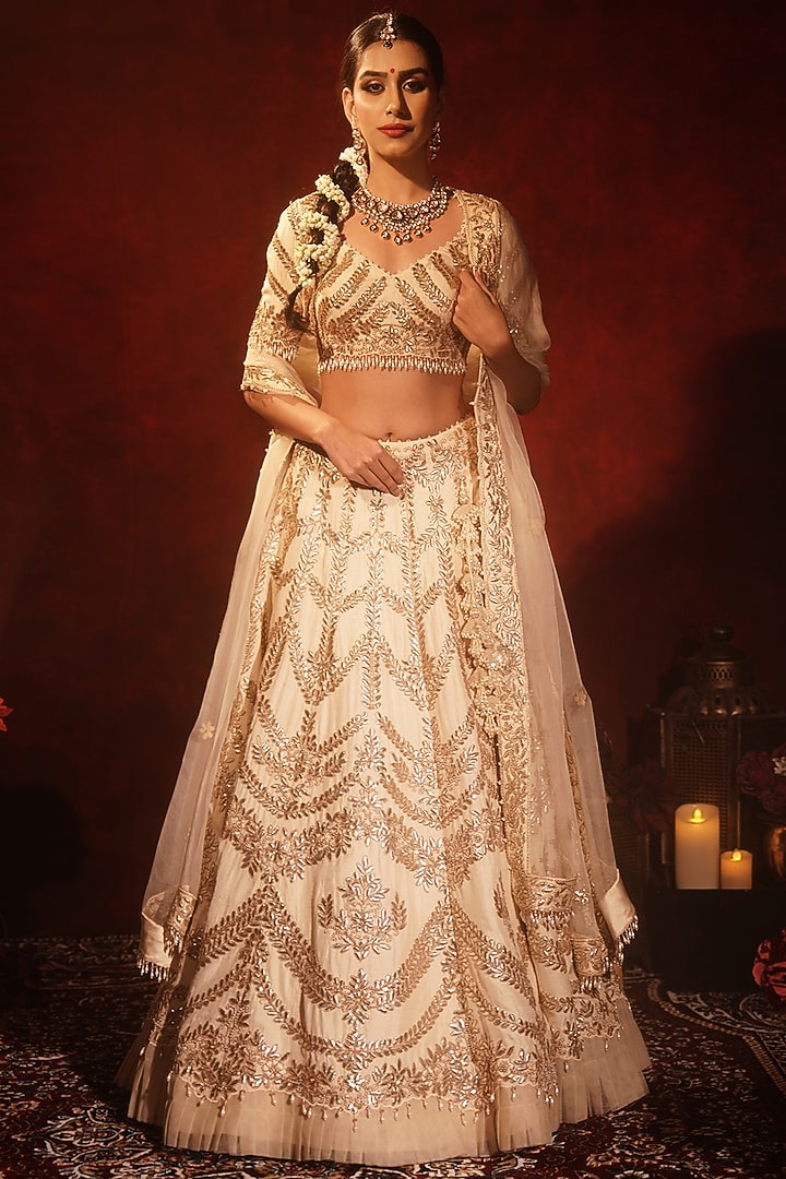 Ivory Raw Silk Embroidered Bridal Lehenga Set by Archana Kochhar at Pernia's Pop Up Shop